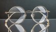 © Bilal - silver bracelet on white, Transparent acetate eyeglasses with round lenses showcased on a reflective surface, ideal for modern optical fashion