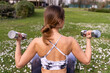 © Marino Bocelli - young beautiful blonde woman in tight sportswear doing light gymnastic exercises outdoors