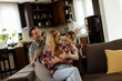 © BGStock72 - Cozy family bonding moment in a warm living room