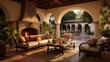 Mediterranean inspired outdoor living room with arched walkways shaded loggias terra cotta tile stucco columns and lush landscaping all around.