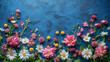 Colorful flowers against a blue textured background.