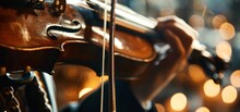 Musical Artist Playing The Violin In A Close-up Shot, Showcasing The Beautiful Details Of The Instrument