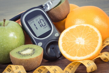 Wall Mural - Glucose meter for checking sugar level, fresh fruits and orange juice. Healthy lifestyle and nutrition during diabetes