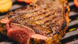 Delicious tomahawk beef steak on grill. Tasty BBQ. Grilled meat.