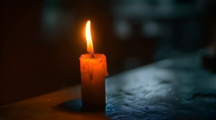 Wall Mural - a lit candle sitting on top of a table