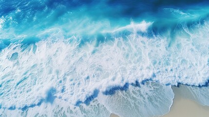 Wall Mural - Beautiful blue ocean water wave during the day. Aerial top down view photo.