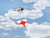 Fototapeta Panele - Drone delivering a gift box and flying