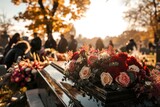 Fototapeta Uliczki - A cemetery with a black casket with flowers on top
