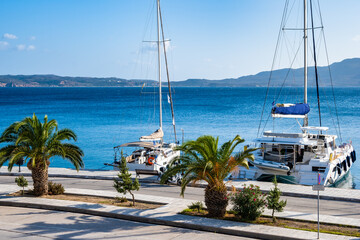 Wall Mural - Catamaran sailing boats in Adamas port, Milos island, Cyclades, Greece.