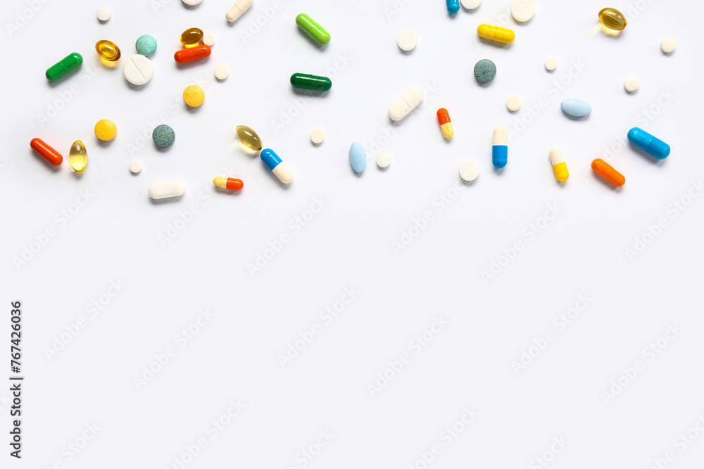 Fish oil capsules and different pills on white background