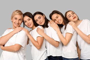 Wall Mural - Many beautiful women on grey background. Women history month