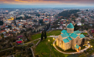 Wall Mural - Aerial view of the ancient city of Kutaisi in the evening, located on the banks of the Rioni River, with a view of ..landmark Bagrati Cathedral
