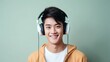 © Svetlana - Happy Asian high school teenage boy student listening to music with headphones. Alpha Generation, Get Alpha child