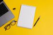 Yearly Planning, Notebook and Pencil with Business Supplies on Yellow Background