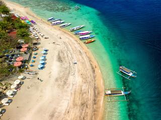 Wall Mural - Aerial view of colorful sunshades on a tropical beach (Gili Air, Indonesia)