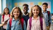 Portrait of cheerful smiling diverse schoolchildren standing posing in classroom looking at camera happy after school reopens. Diversity back to school concept