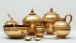 A collection of empty golden brass vessels, traditionally used as water pots for religious rituals during festivals, elegantly isolated against a clean white background