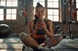 © Iona - Joyful woman sitting on gym floor using smartphone, cheerful, active, workout break, indoor, fitness center.