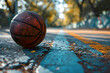 basketball ball on the road against the backdrop of sunset. sports equipment