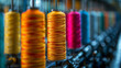 Rolls of colorful thread at textile factory.