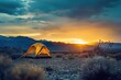 Camping tent in the mountains at sunset. Travel and wanderlust concept