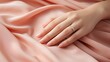 Elegant hand with a fine ring on a pink fabric background, suggesting a subtle moment of grace and beauty. Generative AI
