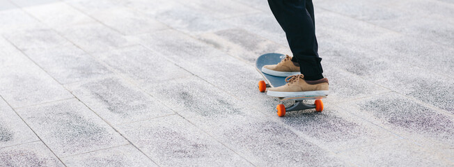 Wall Mural - Skateboarder skateboarding outdoors in city