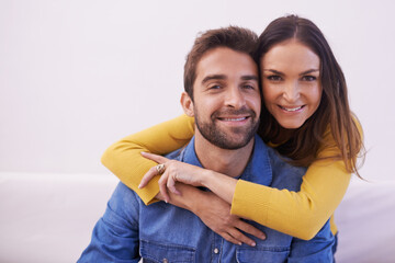 Sticker - Portrait, happy couple and hug on sofa in living room for bonding, love and support to relax together. People, man and woman in romantic relationship, dating and soulmate with commitment at home