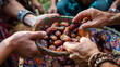 people take dates from a colorful bowl during the breaking of the fast