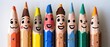 A row of pencils with faces drawn on them