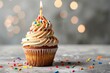© Anns - Delicious birthday cupcake on table on light back
