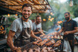 © Moldova-Film - Group of smiling men cooking meat on the grill at an outdoor barbecue party, having fun together. Barbecue event with men cooking meat on the grill outdoors.