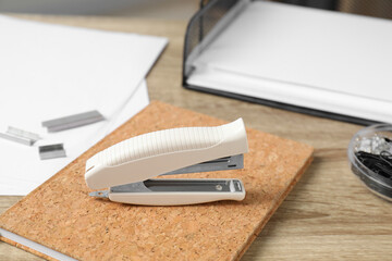 Canvas Print - Stapler, notebook and papers on wooden table