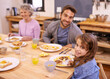 © Duncan M/peopleimages.com - Love, breakfast and family in portrait or kitchen with food, eating or bonding together at table. Meal, pancakes and father or grandmother with child for brunch, nutrition or communication at home