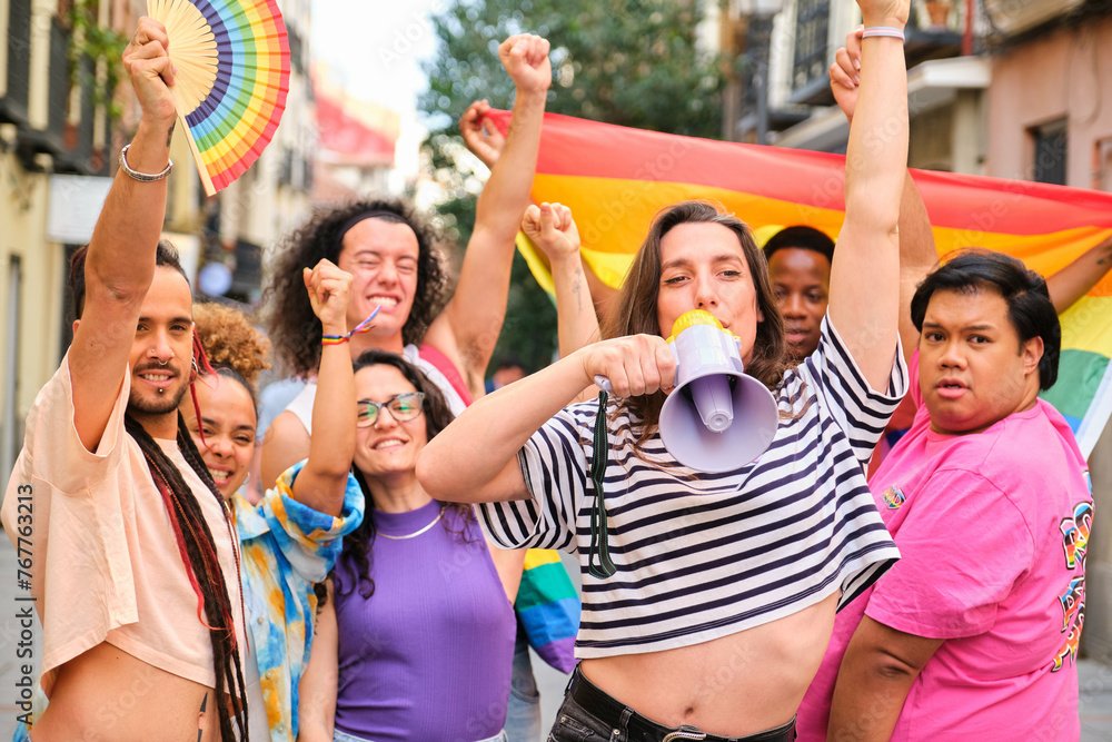 LGBTQ people with rainbow flags and a megaphone fighting for their ...