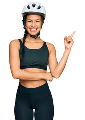 Poster - Beautiful hispanic woman wearing bike helmet smiling happy pointing with hand and finger to the side