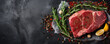 Raw piece of beef meat. Fresh meat on dark slate or black board top view.