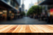 An empty wooden table in front of a blurred city street. High quality photo