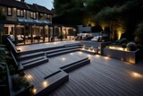 Fototapeta  - Composite decking in ash grey with two levels deck lights and ideal for a landscape gardener 