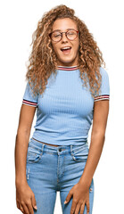 Poster - Beautiful caucasian teenager girl wearing casual clothes and glasses winking looking at the camera with sexy expression, cheerful and happy face.