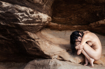  Young fully nude woman relaxing on sea sandy beach