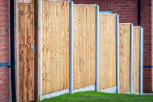 New Built Wooden Boarded Fence Background In English Town Uk