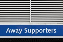 Away Supporters Entrance Sign On A Wall