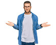 © Krakenimages.com - Young caucasian man wearing casual clothes clueless and confused with open arms, no idea concept.
