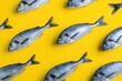 Creative packaging design with fish pattern on yellow background.