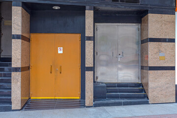 Two Double Utility Metal Doors at Back of Building in Hong Kong