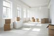 © Victor Bertrand - Empty room with sunlight casting shadows through windows and unopened moving boxes.