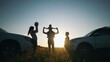 happy family play ball next to car silhouette a camping vacation. Road trip fun. happy family adventures with car travel and camping silhouette. car travel and silhouette camping expedition sunset