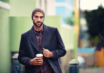 Poster - Fashion, portrait or man in street with coffee or coat for edgy clothes, outdoor travel or elegant style in winter outfit. City, drink or stylish guy in urban town in beanie or trendy jacket in Italy