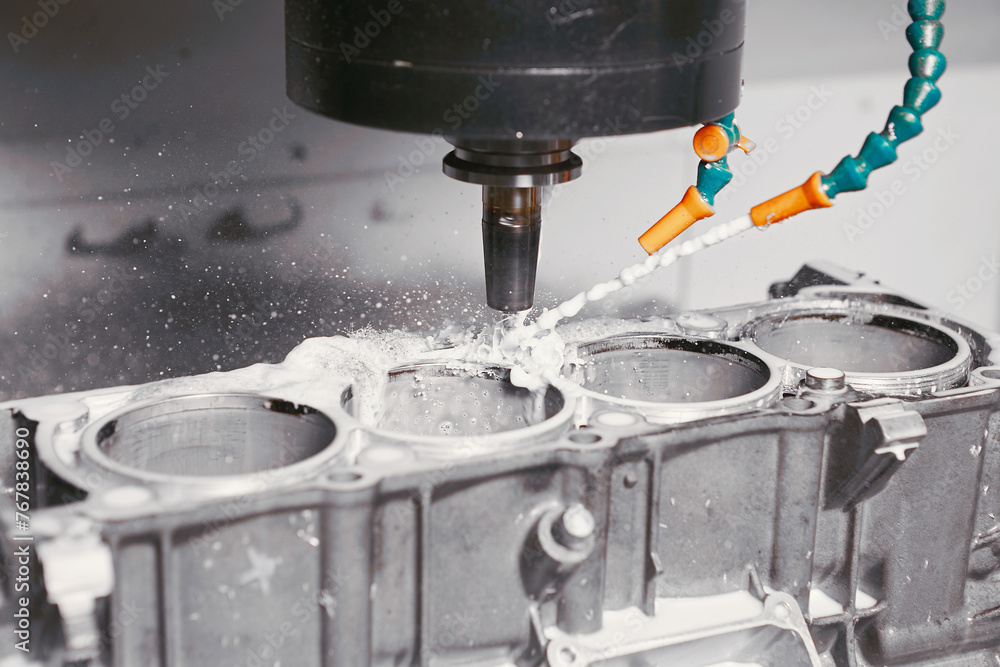 Milling Machine Making Engine CNC milling machine grinds holes in car engine with coolant. Process of ...